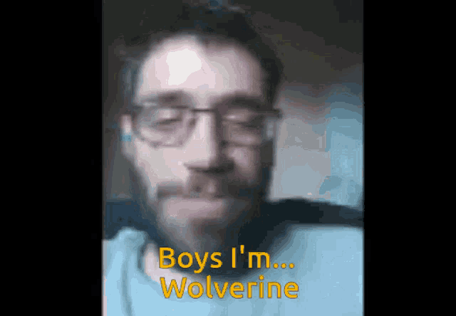a blurred image of a man with the words boys i 'm wolverine