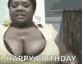 a woman with very large breasts is wearing a yellow shirt and saying happy birthday .