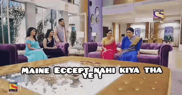 a group of people are sitting in a living room with the words maine except nahi kiya tha on the table