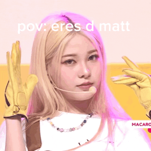 a woman wearing yellow gloves and a necklace with the words pov eres d matt written above her