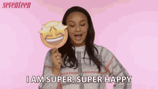 a woman holding a smiley face with a star in her eye and the words i am super super happy