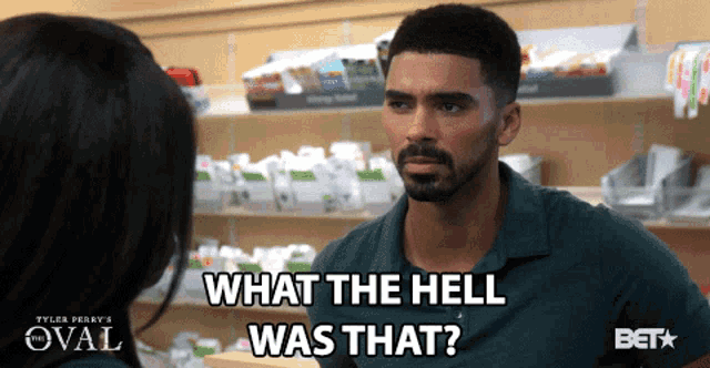 a man in a green shirt says what the hell was that in front of a woman