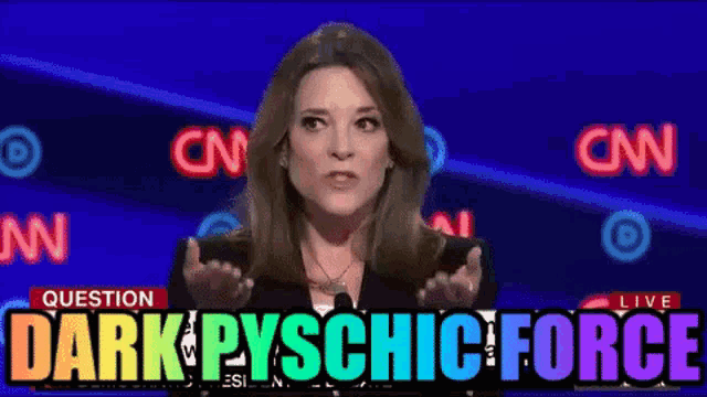 a woman stands in front of a cnn logo and says dark pycho force