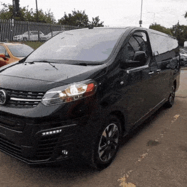 a black van with the word vauxhall on the front
