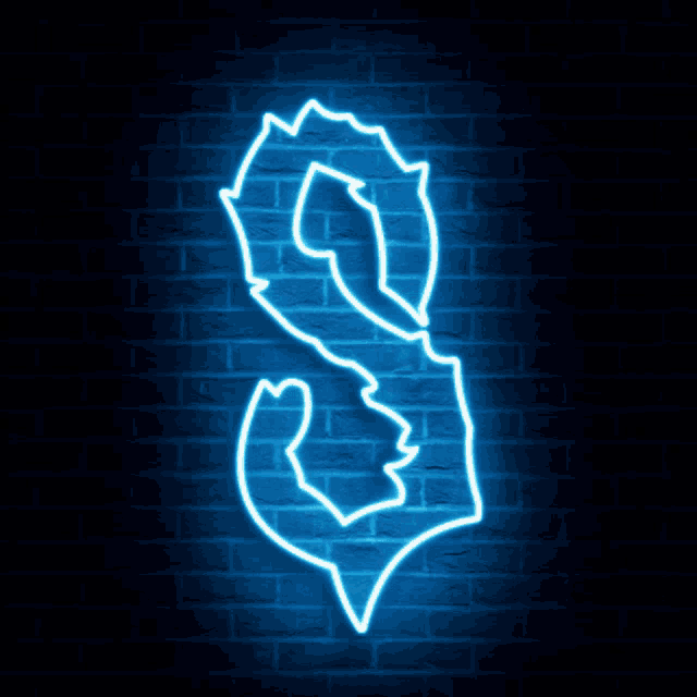 a neon sign that says ' s ' on a brick wall