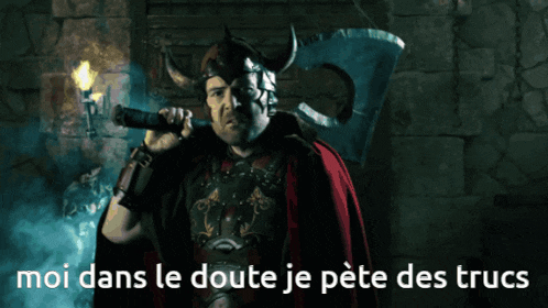 a man in a horned helmet is holding a torch and the words moi dans le doute je pete des trucs are below him