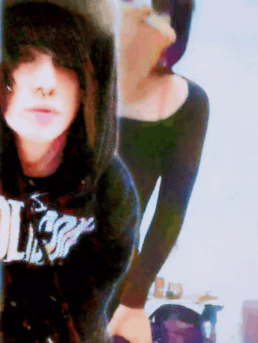 a girl wearing a black shirt that says rolling stones