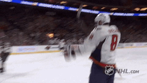 a hockey player with the number 8 on his back