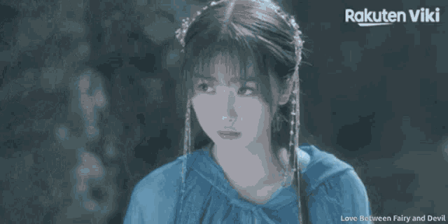 a rakuten viki advertisement with a girl in a blue coat