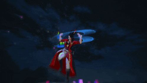 a woman in a green and red dress is standing in front of a dark sky