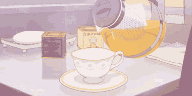 a cartoon drawing of a cup of tea and a box of tea
