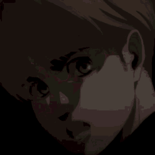 a close up of a cartoon character 's face with a dark background