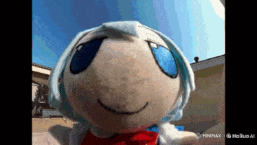 a close up of a stuffed animal with blue eyes and white hair