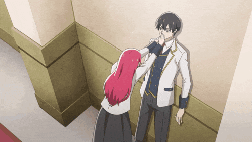 a girl with red hair touching a man 's nose