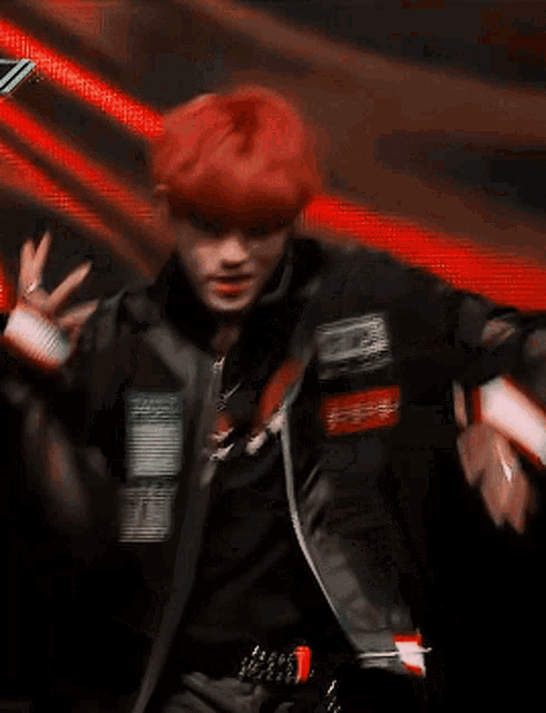 a man with red hair is wearing a black jacket with a patch that says advisory on it