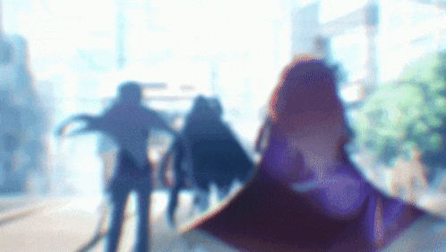 a blurred image of a group of people walking down a street