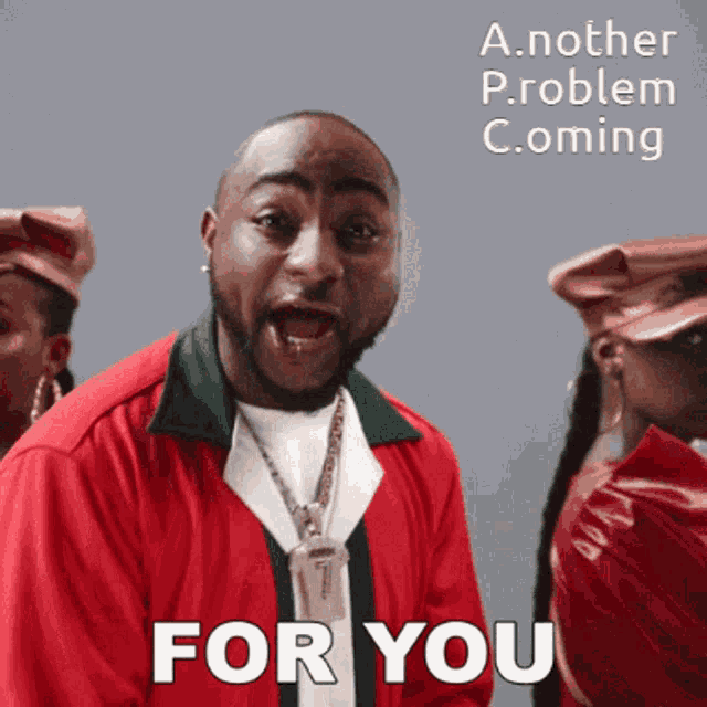 a man in a red jacket says " for you " in front of two women