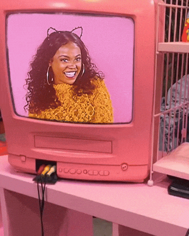 a pink television with a picture of a smiling woman on it