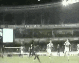 a soccer game is being played in a stadium that has a sign that says ' united ' on it
