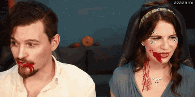 a man and a woman with blood on their faces and azaaami written on the bottom right