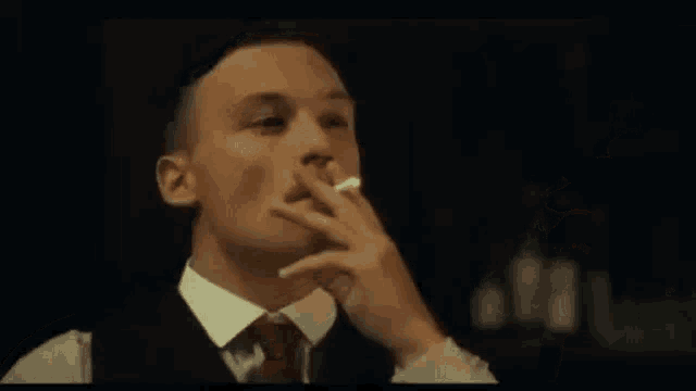 a man in a suit and tie is looking up