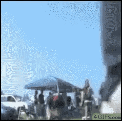 a blurred image of a group of people with a 4gifs.com link at the bottom