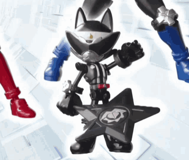 a black toy with a star on it is standing next to another toy