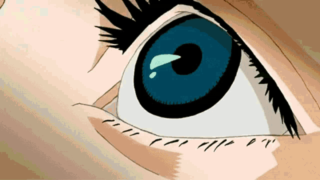 a close up of a person 's eye with a tear coming out of it