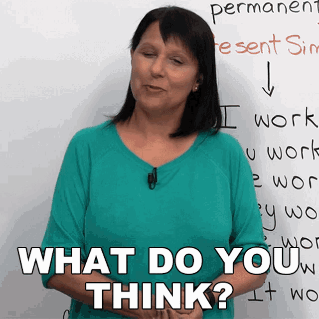 a woman stands in front of a white board with the words " what do you think " written on it