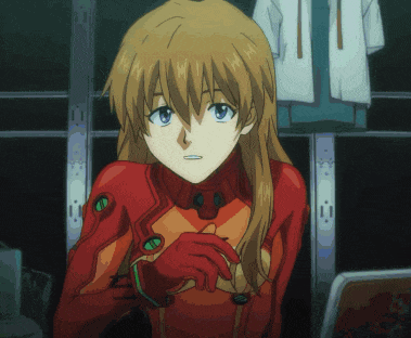 a girl in a red suit with a green emblem on her chest