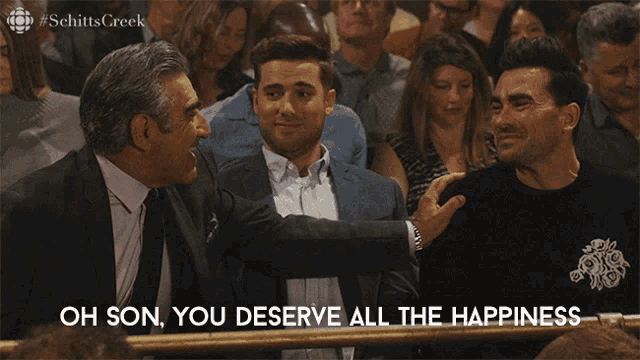 a scene from schitt 's creek shows two men talking to each other and the caption oh son you deserve all the happiness