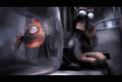 a woman is sitting next to a fish in a jar .