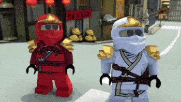 two lego ninjago figures are standing next to each other on a street