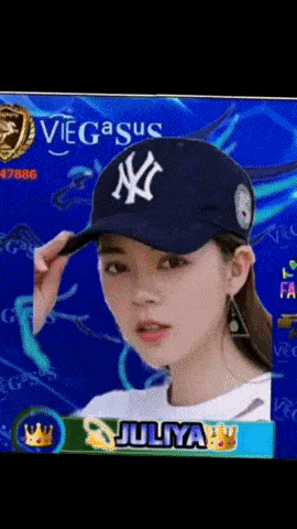 a girl wearing a new york yankees hat with juliya written on the bottom