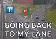a picture of a highway with the words going back to my lane written on it .