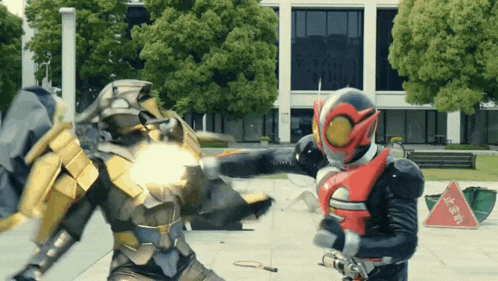 a man in a superhero costume is fighting another man in a superhero costume