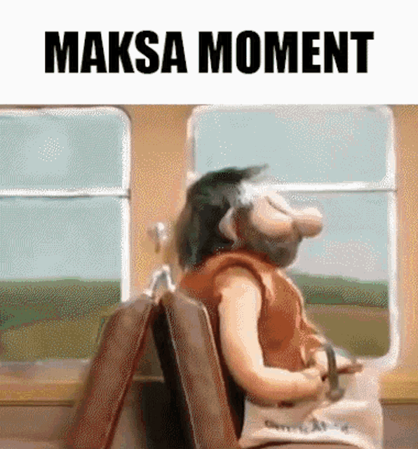 a cartoon character is sitting on a train with a suitcase and the words ' maksa moment ' on the bottom .