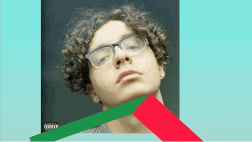 a picture of a young man with curly hair and glasses has a parental advisory label