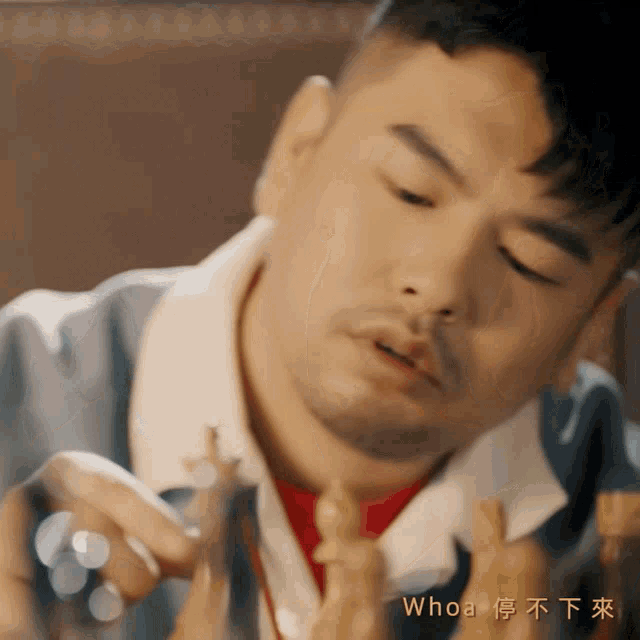 a man playing a game of chess with the words whoa in the corner