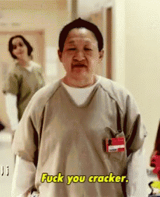 a woman in a scrub top is saying fuck you cracker