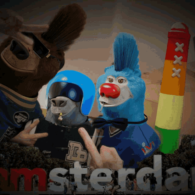 a group of stuffed animals standing in front of a sign that says amsterda