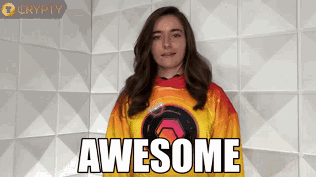 a woman wearing a yellow and red shirt says awesome