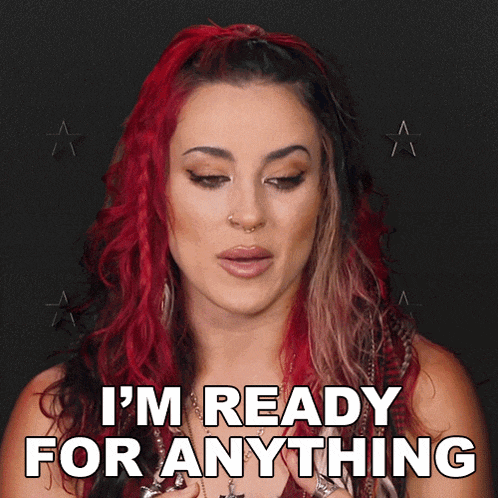 a woman with red and black hair is ready for anything