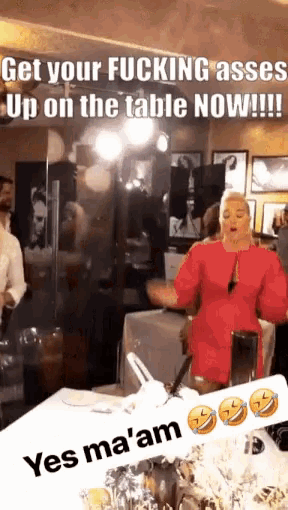 a woman in a red dress is standing in front of a table with a caption that says get your fucking ass up on the table