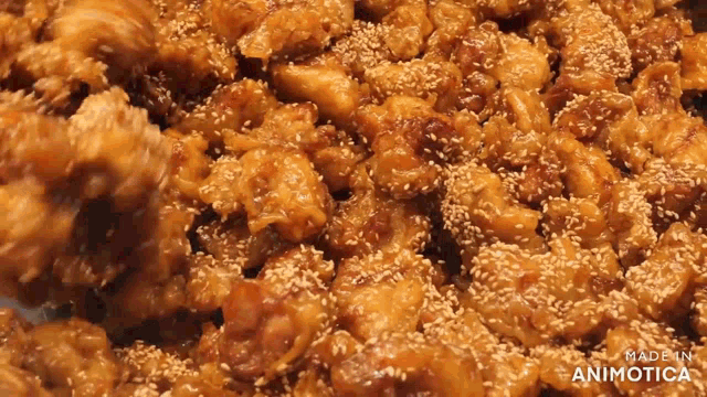 a close up of a pile of food with the words made in animatica on the bottom right