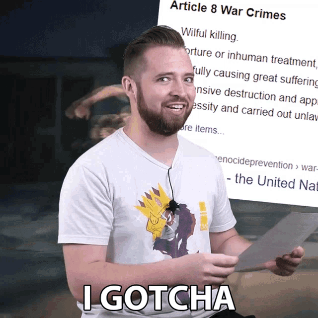 a man holding a piece of paper that says article 8 war crimes on it