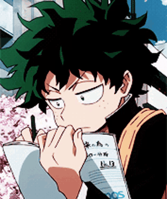 a boy with green hair is writing on a piece of paper with a pen