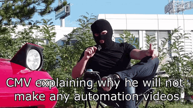 a man in a ski mask sits in front of a red car with the caption cmv explaining why he will not make any automation