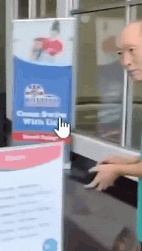 a man is standing in front of a counter with a sign that says ' choose burger with us ' on it