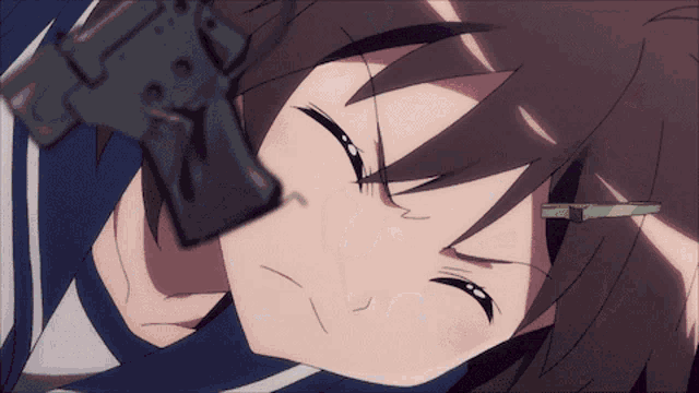 a close up of a girl holding a gun in her mouth
